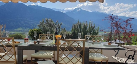 Outdoor dining. Grand Maisonette-Attica, Jenins, Top of Heidiland