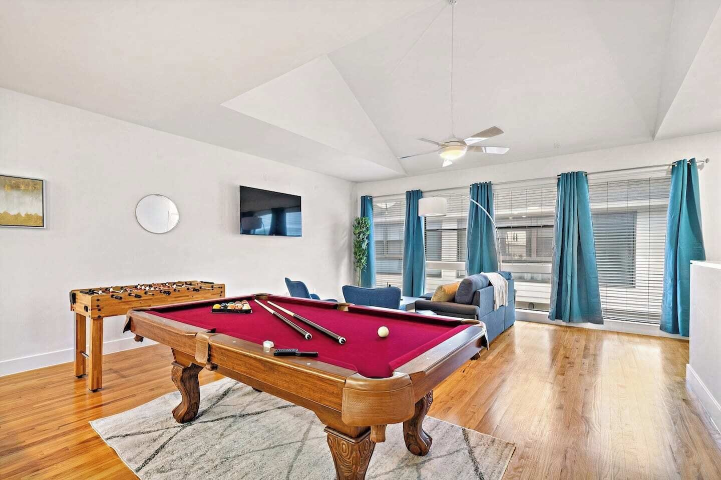 Full-size pool table and foosball table included.