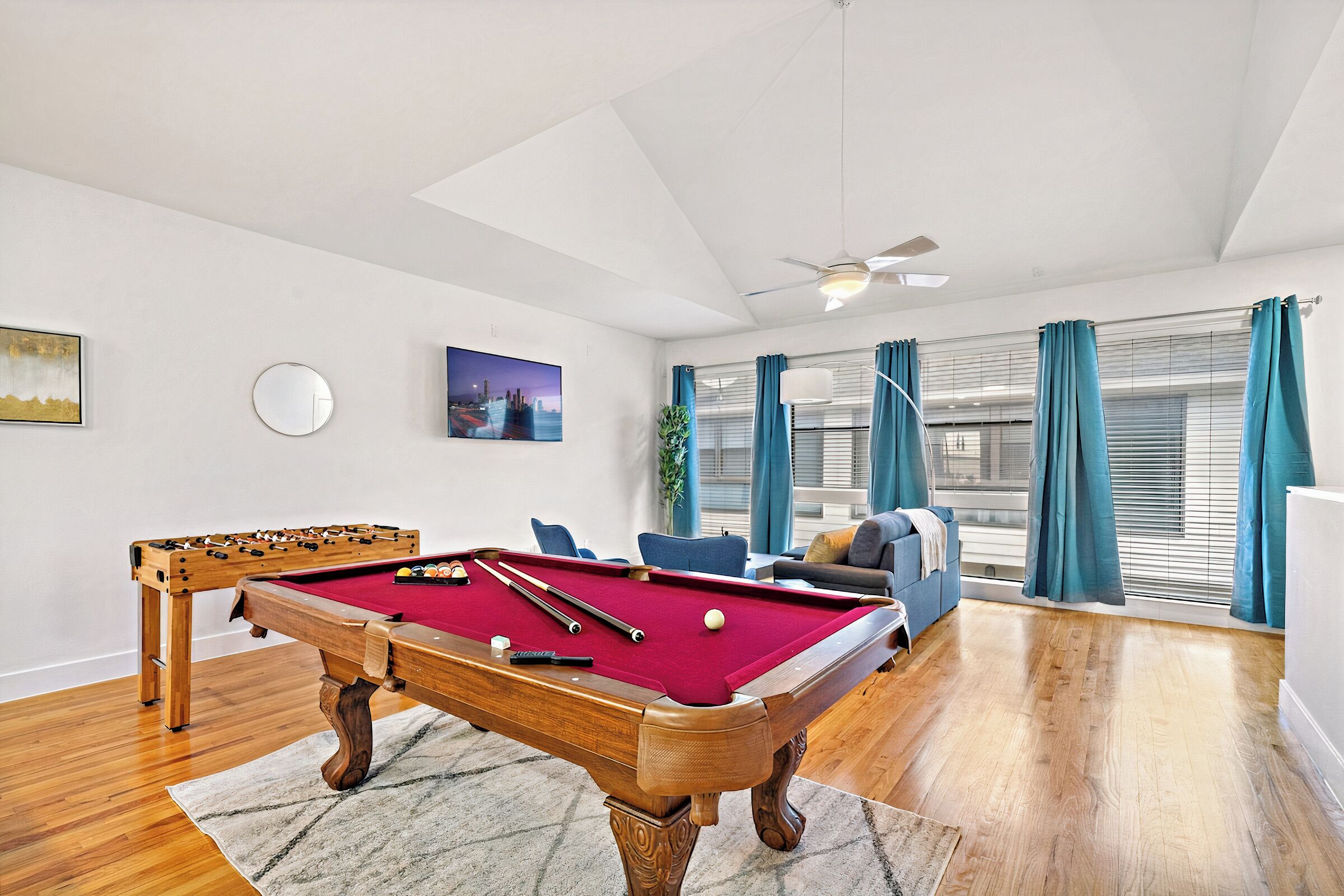 Full-size pool table and foosball table included.