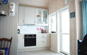 Fridge, stovetop, dishwasher, coffee/tea maker