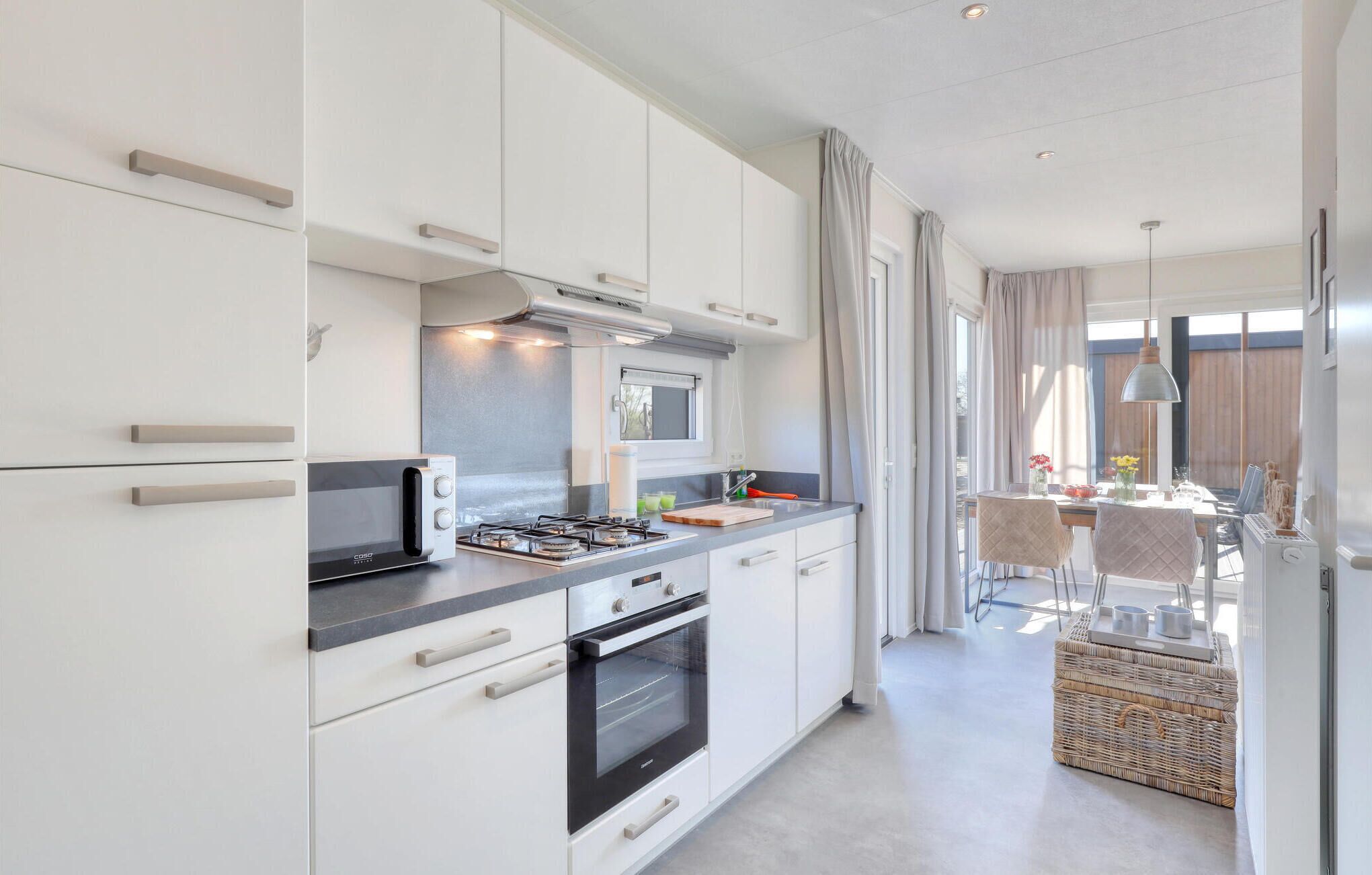 Fridge, stovetop, dishwasher, coffee/tea maker