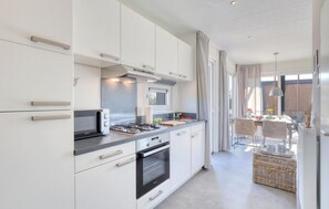 Fridge, stovetop, dishwasher, coffee/tea maker