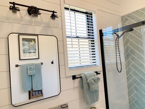 Shower, hair dryer, towels