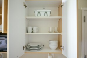 Full-sized fridge, microwave, stovetop, coffee/tea maker