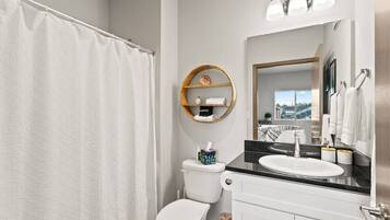 Bathtub, hair dryer, towels