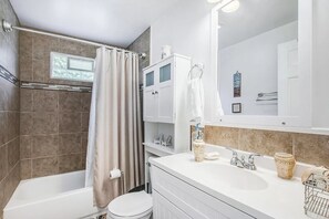 Combined shower/tub, hair dryer, towels, soap