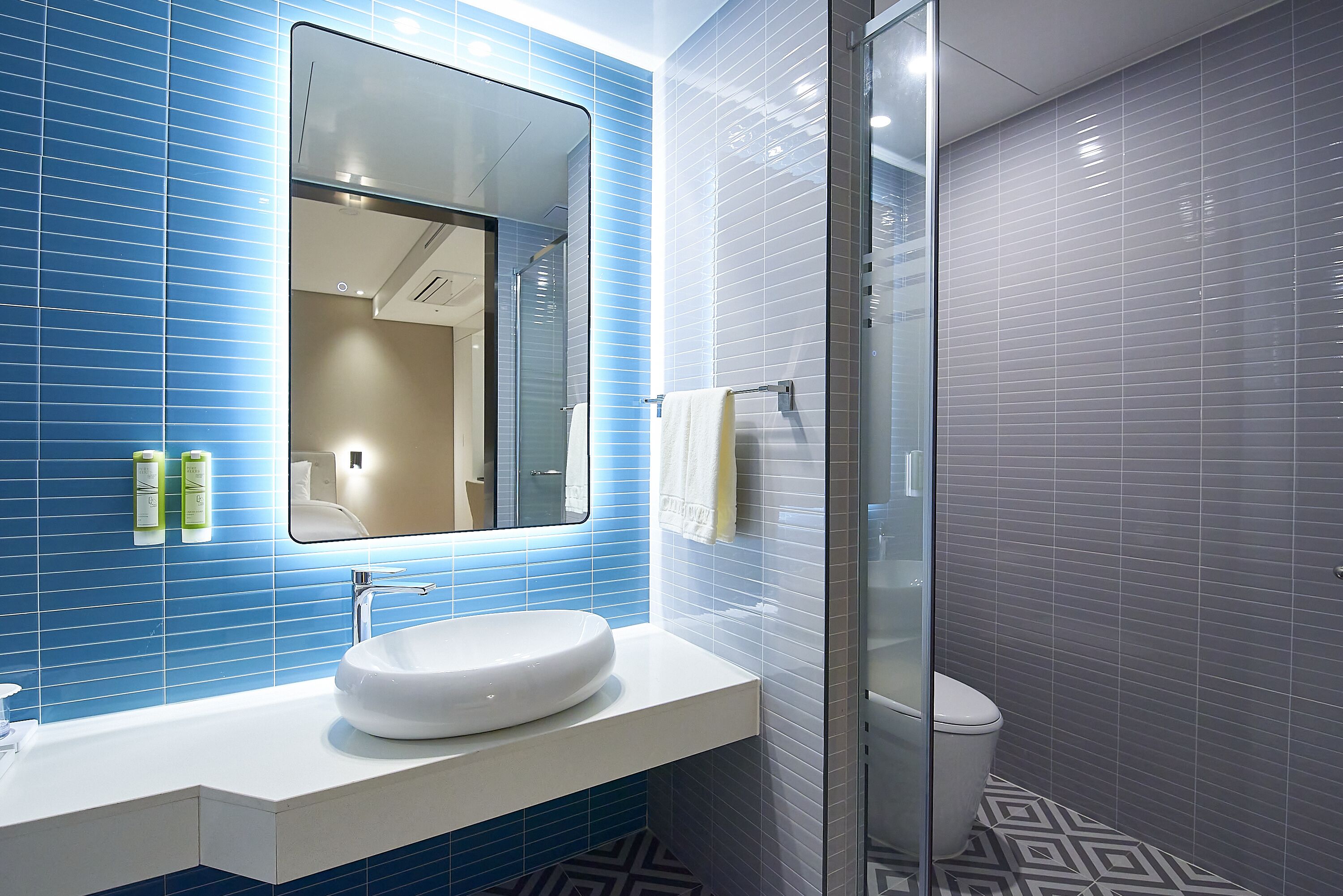 superior twin room (shower) | bathroom | hair dryer, bathrobes, slippers, towels