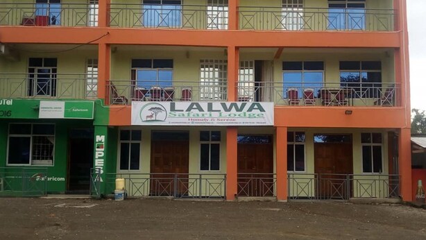 A multi-story building with a sign for Lalwa Safari Lodge. - Lalwa Safari Lodge (Kabarnet)