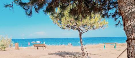 On the beach, sun-loungers