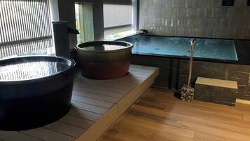 Relax in the hot tubs, surrounded by a unique tile pattern and natural light.