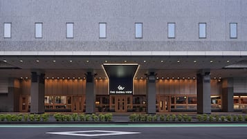 A modern hotel entrance with a prominent sign reading "The Global View."