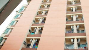 A multi-story residential building with balconies, air conditioning units, and a uniform architectural design. - Meesook Residence (Nonthaburi)