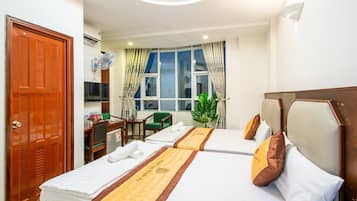Superior Quadruple Room, Garden View | Desk, bed sheets