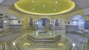 A spacious lobby with a central fountain, arched ceilings, and marble flooring. - Divan Ankara (Ankara)