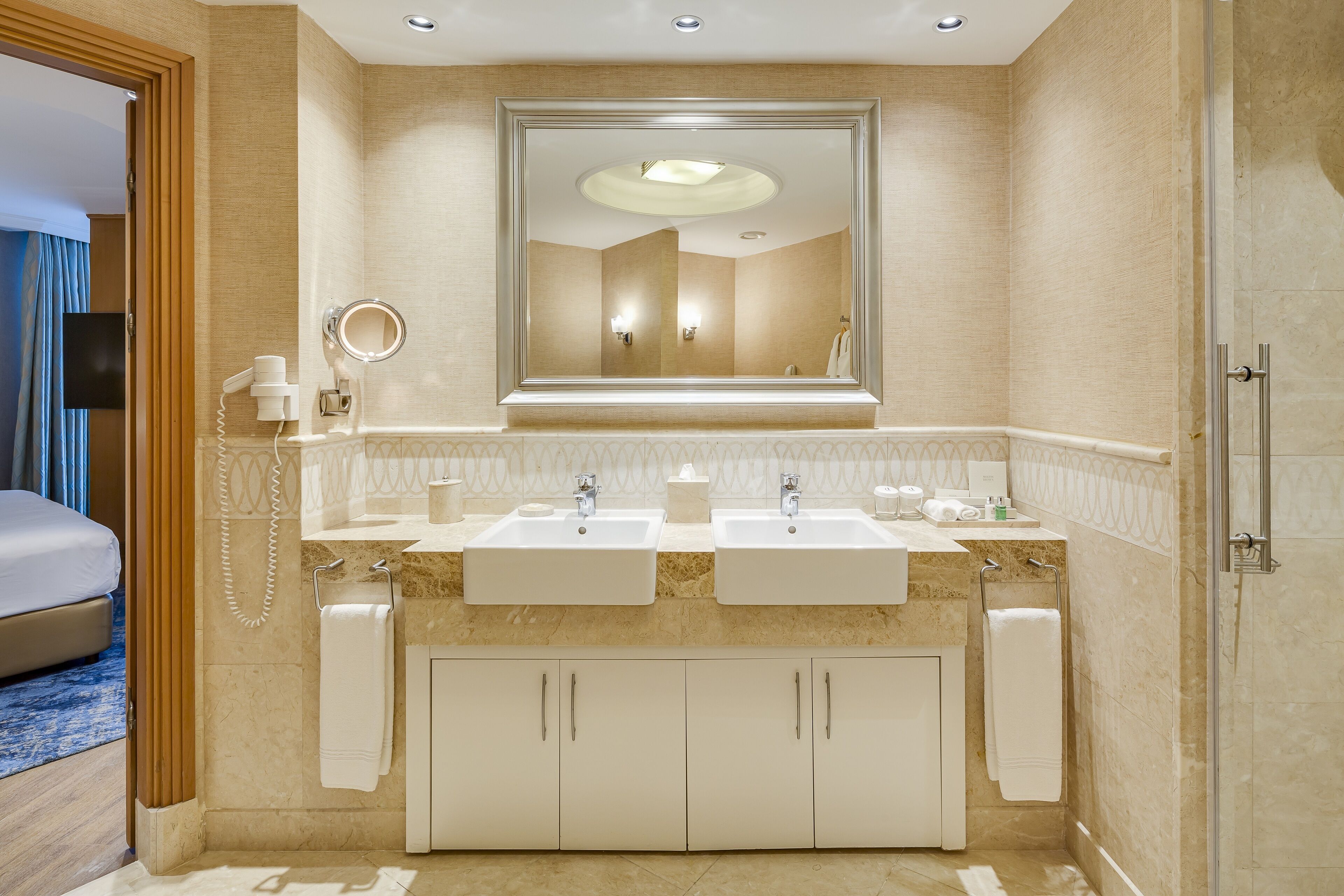 separate bathtub and shower, hair dryer, slippers, towels