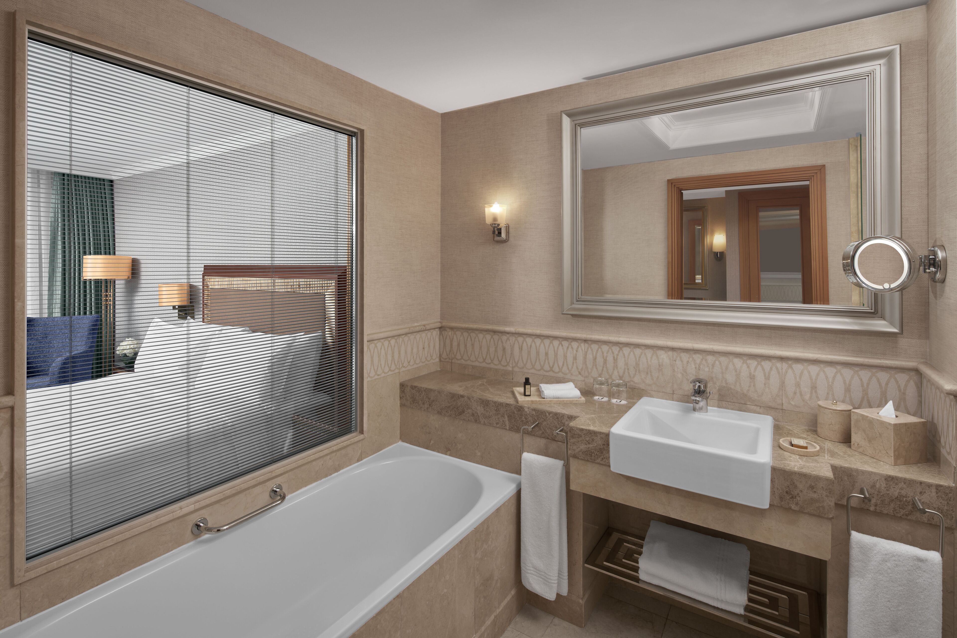 separate bathtub and shower, hair dryer, slippers, towels