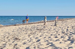 A sandy beach with a clear sky.
