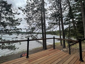 Terrace/patio - Northwoods lakeside cabin just steps from Butternut Lake with dock and firepit! (Three Lakes)