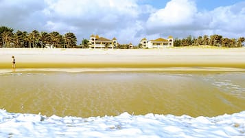 On the beach, white sand, free beach cabanas, sun loungers
