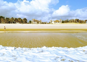 On the beach, white sand, free beach cabanas, sun loungers