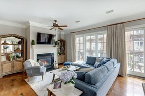 TV, fireplace, offices - Luxury Bay Street Condo featuring Dual King Suites (Savannah)