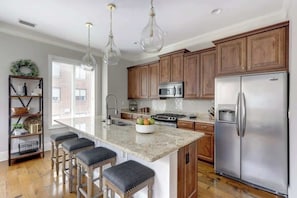 Fridge, microwave, oven, stovetop - Luxury Bay Street Condo featuring Dual King Suites (Savannah)