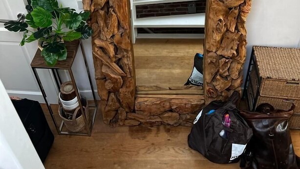 A staircase with a wooden frame and a mirror reflecting the stairs. - Private rooftop 35m2, high-end apartment (Amsterdam)