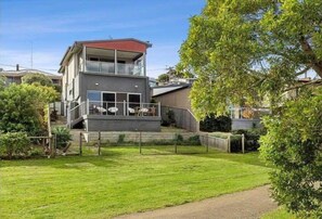 Enjoy a retreat with a spacious balcony overlooking a well-maintained lawn.