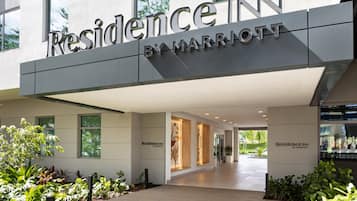 A modern hotel entrance with a clear sign reading "Residence Inn by Marriott".