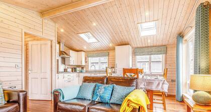 Walnut Lodge is a delightful 2-bedroom Nordic Style lodge sleeping 4 persons.