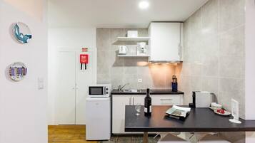 Fridge, microwave, stovetop, coffee/tea maker