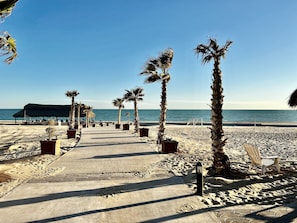 On the beach, sun loungers, beach towels