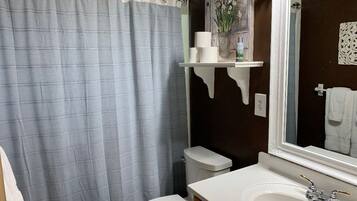 Combined shower/tub, hair dryer, towels, soap