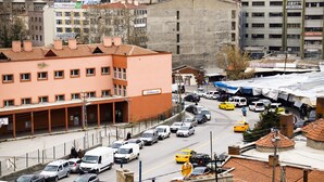 A busy urban street with various vehicles, including cars, vans, and taxis. - Ankara Santral Otel (Ankara)
