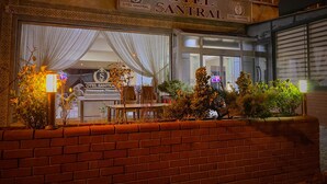The exterior of the Hotel Santral with a brick facade, large windows, and a signboard. - Ankara Santral Otel (Ankara)