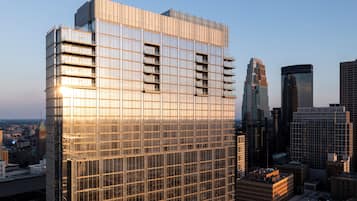 A high-rise building with a grid of windows and a modern architectural design.