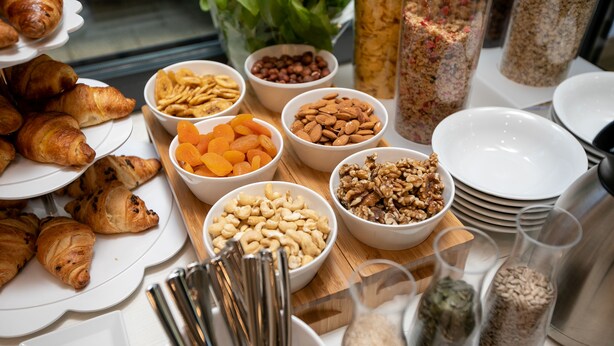 A breakfast buffet with various pastries, nuts, and dried fruits. - Hotel Antonio (Makarska)