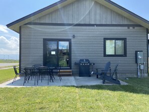 Enjoy outdoor dining and relaxation on the covered patio with a barbecue grill.