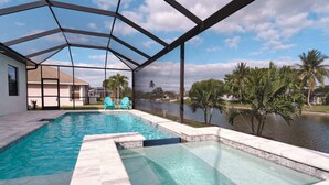 A swimming pool with a glass enclosure, two turquoise chairs, and a view of a lake with palm trees. - Waterfront home with pool and spa close to shopping (Cape Coral)