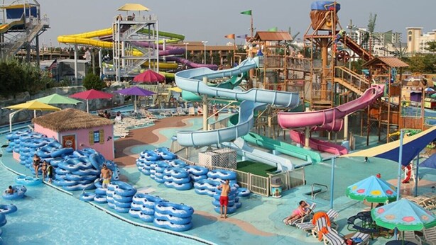 A water park with multiple slides and inflatable rafts. - Sunset Beach Bliss| Walk to Beach & Waterpark (Ocean City)