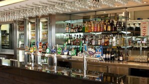 A bar area with multiple beer taps and a variety of liquor bottles. - Nightcap at the Ranch Hotel (Sydney)
