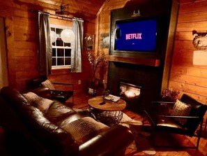 TV, fireplace - Creekside Cabin • Hot Tub, Firepit & Views (Cosby)