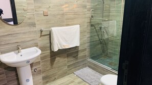 Shower, hair dryer, towels, soap