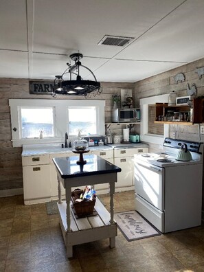 Microwave, coffee/tea maker, cookware/dishes/utensils