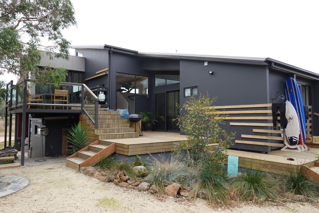 Outdoor decking surrounds the house