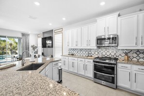 Fridge, microwave, oven, stovetop - The Dream at Reunion | 5BR, 5.5 Bath Oasis w/ Private Pool and Game Room Near Orlando Theme Parks (Kissimmee)
