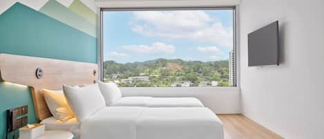 A modern bedroom with a large window, a bed, a bedside table, and a mounted TV.