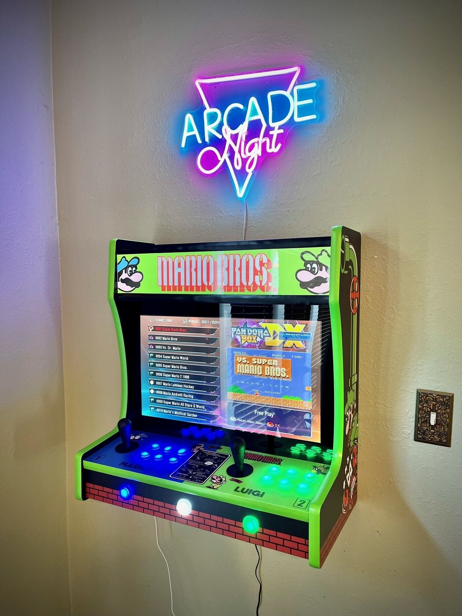 A retro arcade machine with a neon sign above it.