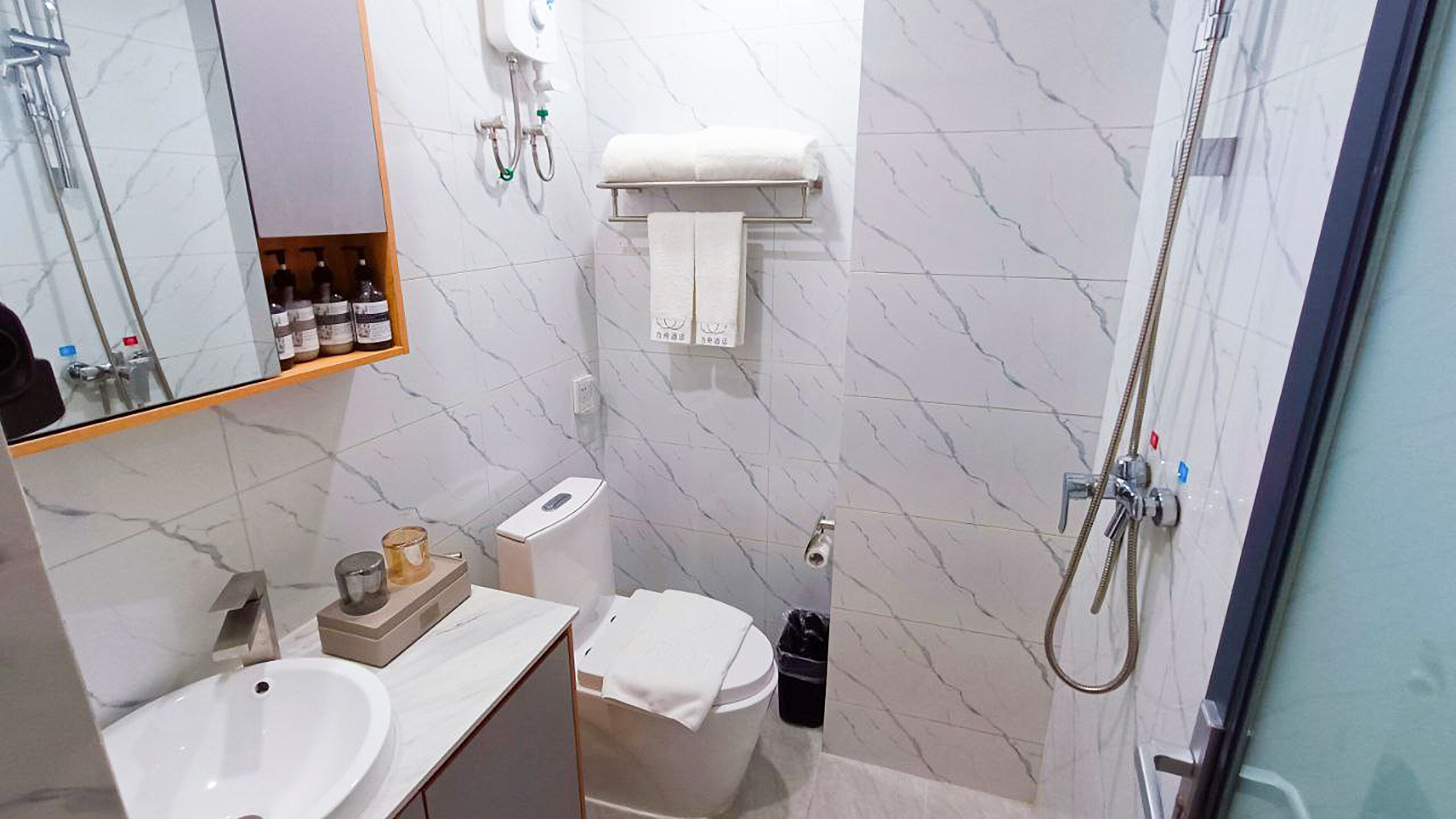 standard twin room | bathroom | shower, rainfall showerhead, hair dryer, bathrobes