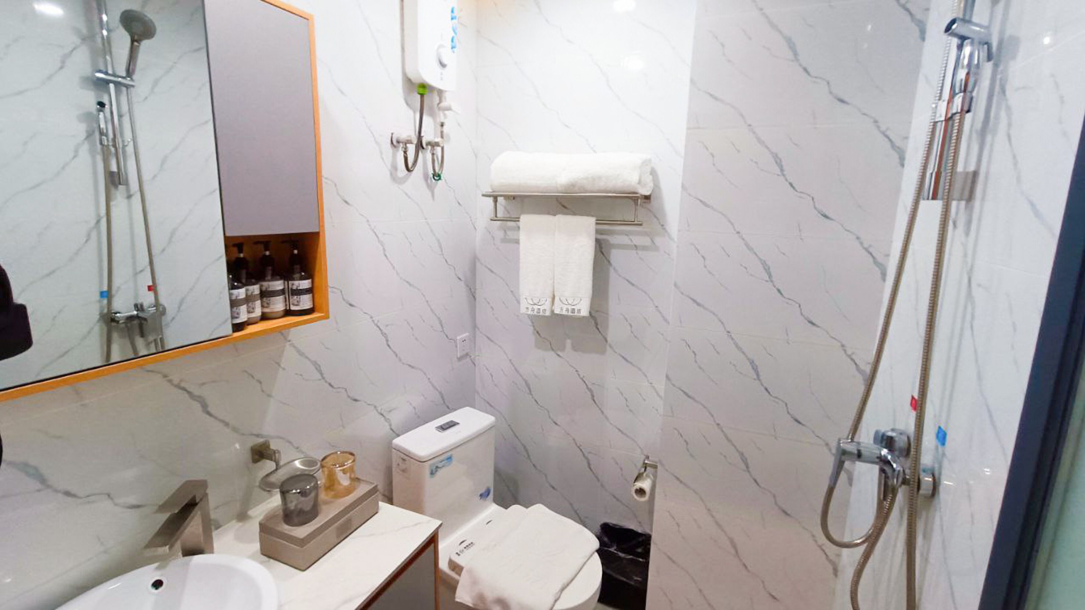 deluxe twin room | bathroom | shower, rainfall showerhead, hair dryer, bathrobes